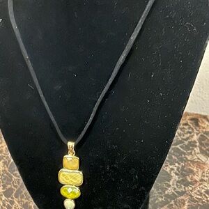 Gold tone and Yellow Pendant Necklace on black cord